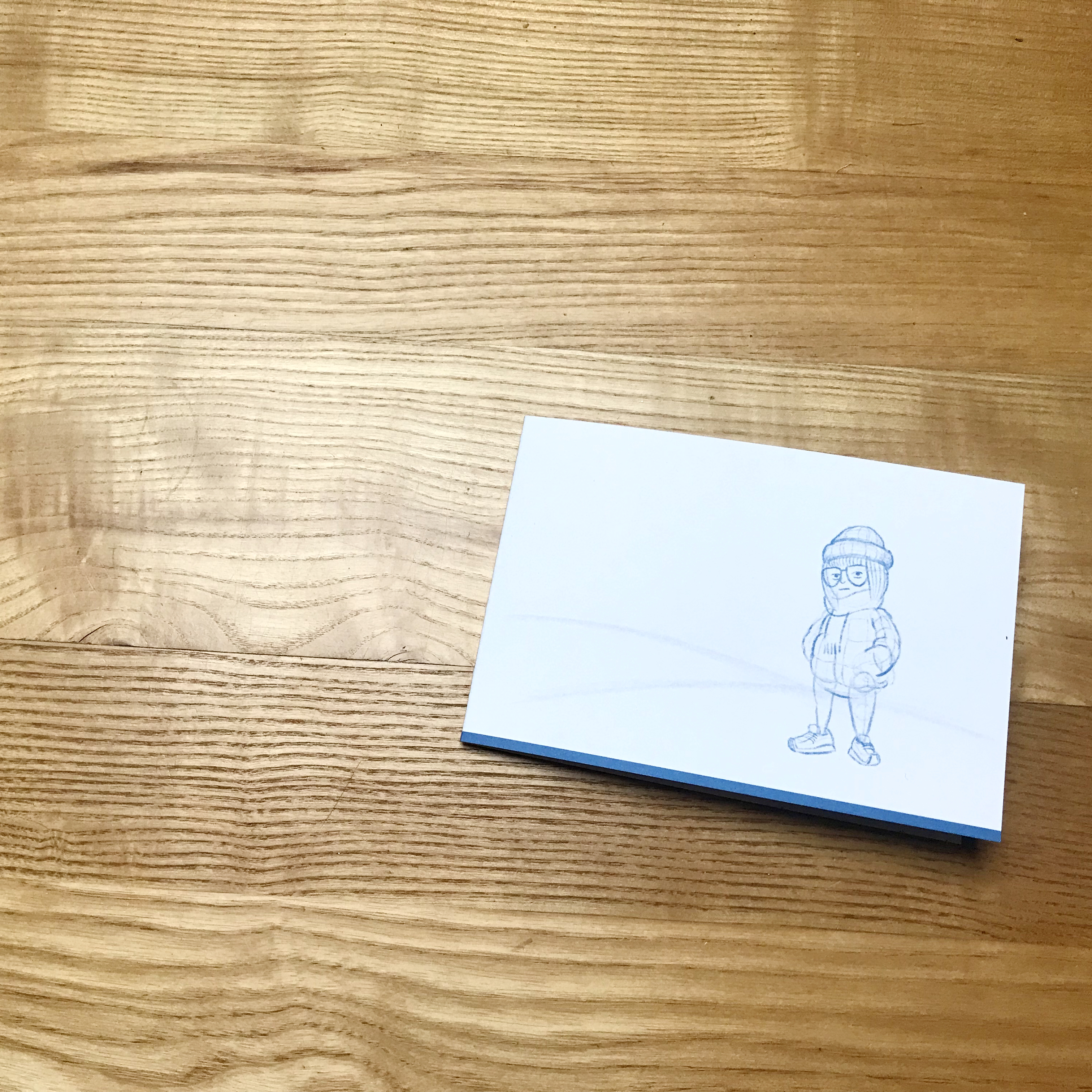 winterkarte Vorderseite - kleine Figur in skizzenhaften Stil zu sehen